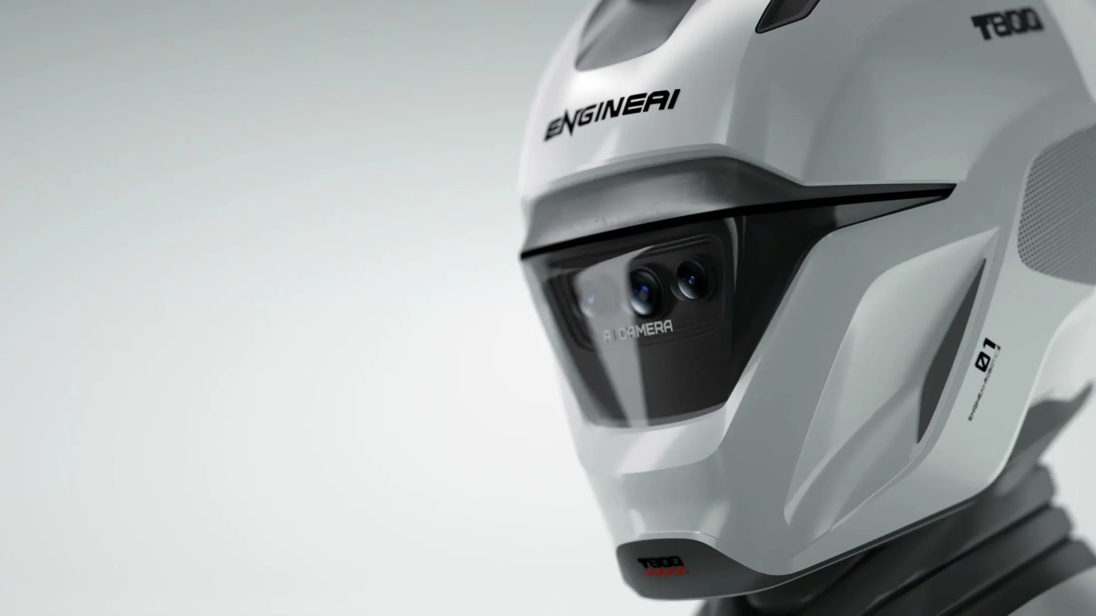 Capacete do EngineAI T800 em close, com as inscrições ENGINEAI e T800 e as duas lentes da câmera atrás do visor